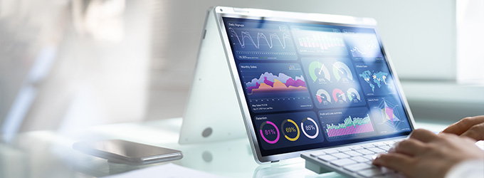 person using a laptop with data analysis dashboards displaying graphs and charts representing statistics and insights related to business and technology 2 insights 2 analytics