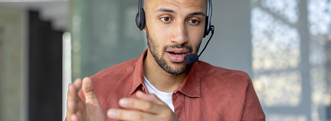 man speaking with a headset in a bright environment demonstrating effective communication skills and engagement in a conversation 4 key points to remember