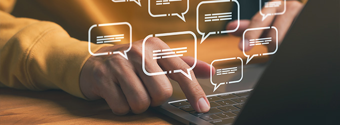 person typing on laptop with chat bubbles representing online communication and social interaction about 4 digital conversations